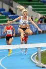 Emily Stewart on her way to winning the 3000 metres steeplechase at the Scottish Championships, Scotstoun  Stadium, Glasgow.
